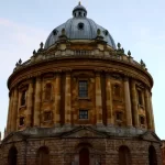 The Radcliffe Camera as seen from a private walking tour of Oxford with Chris Peters. The building is in the shade with a brilliant blue sky behind it.