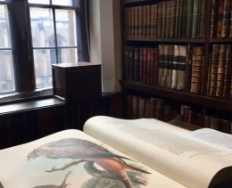 An open book in a library of Oxford as part of the literary walking tour.