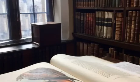 An open book in a library of Oxford as part of the literary walking tour.