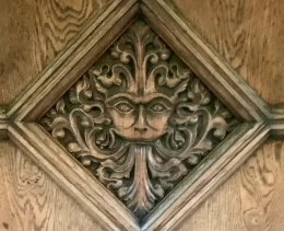 The Narnia Door as part of the Inklings private walking tour of Oxford with Chris Peters. This has a face carved into the wood of the door.