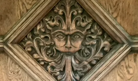 The Narnia Door as part of the Inklings private walking tour of Oxford with Chris Peters. This has a face carved into the wood of the door.