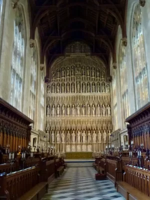 This Oxford college chapel is photographed in the day. The stunning vestibule has tiled floors, wooden pews and artwork adorning the walls.