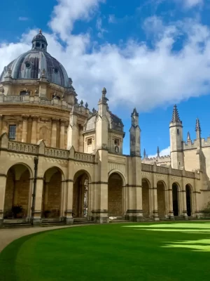 The stunning buildings of an Oxford college. The arches, vaults, and spires of this college are visible in the sunlight. These architectural joys and more can be seen on the private walking tour of Oxford with Chris Peters.